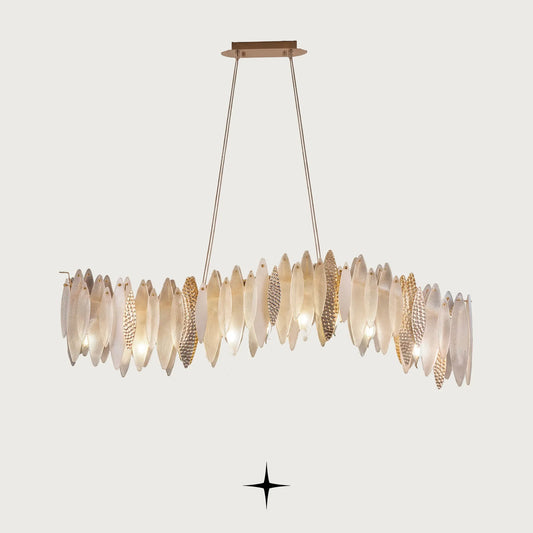 Linear Petra Murano drop-shaped glass island chandelier with brass accents on light grey background