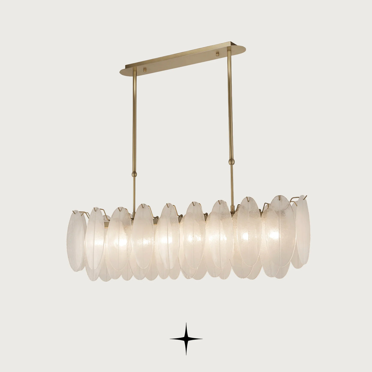 Linear Serene chandelier featuring oval crystals and a radiant golden structure
