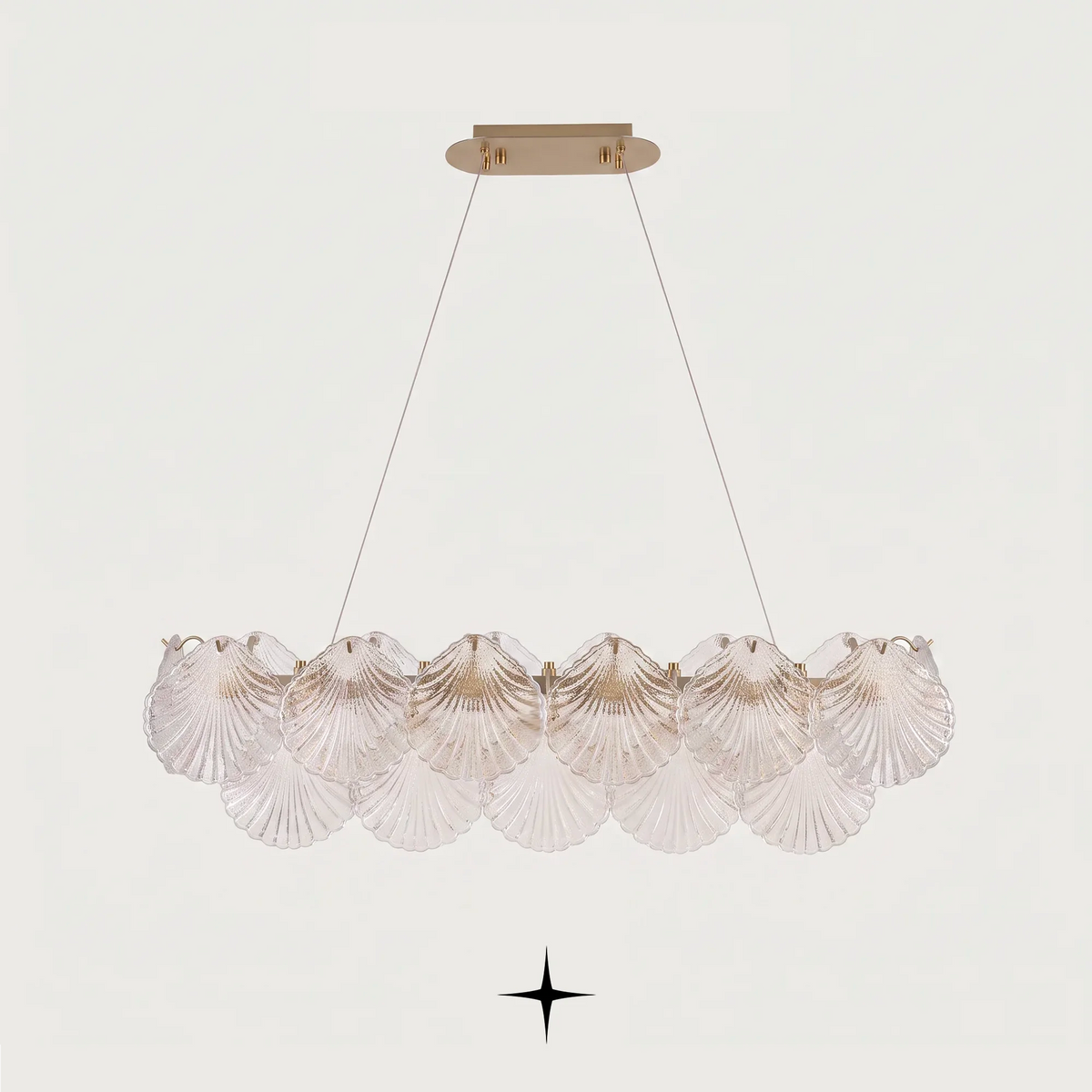 Close-up detail of illuminated textured seashell glass diffusers on Linear Shellina fixture
