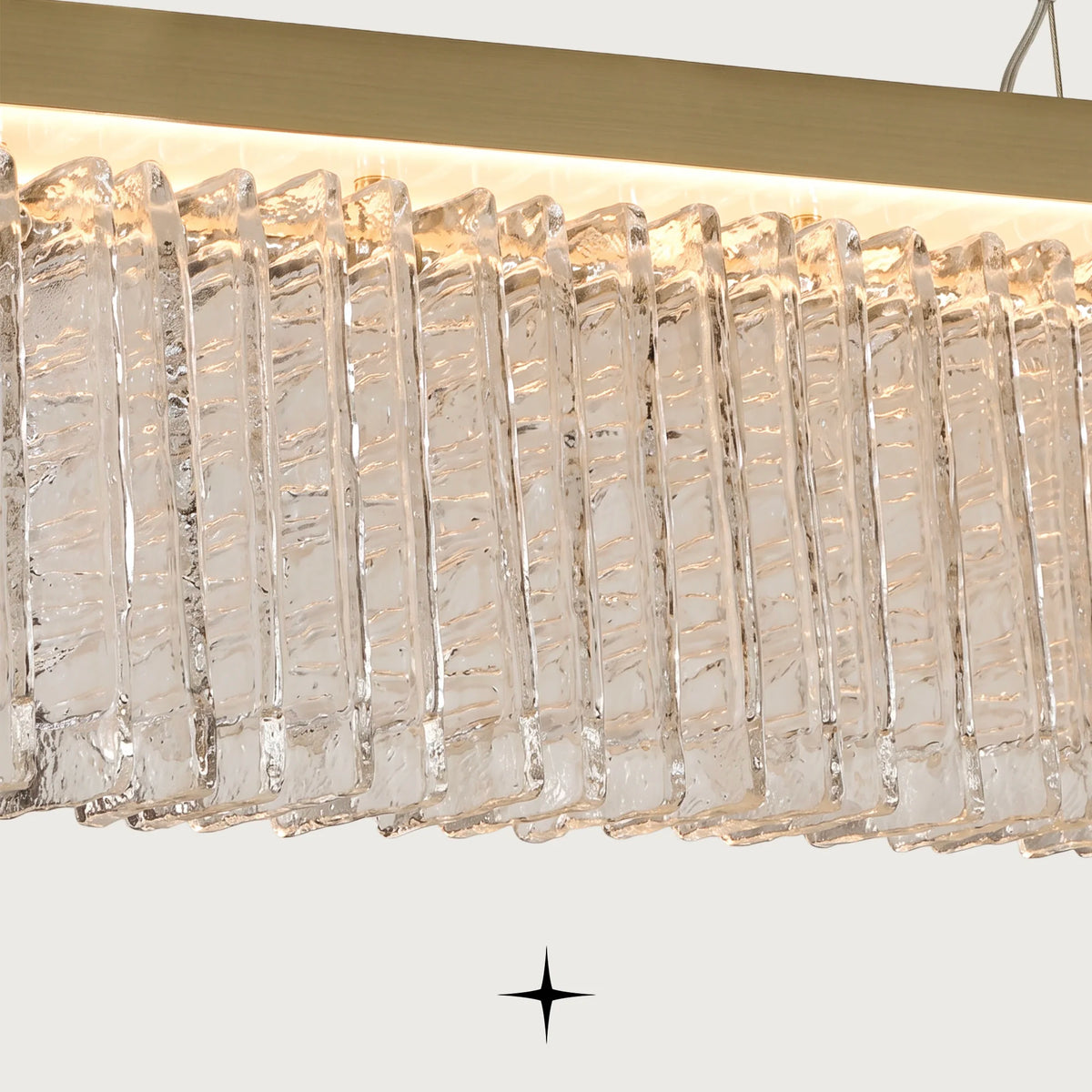Linear Waterfall chandelier featuring cascading Murano-style glass elements and sophisticated warm illumination
