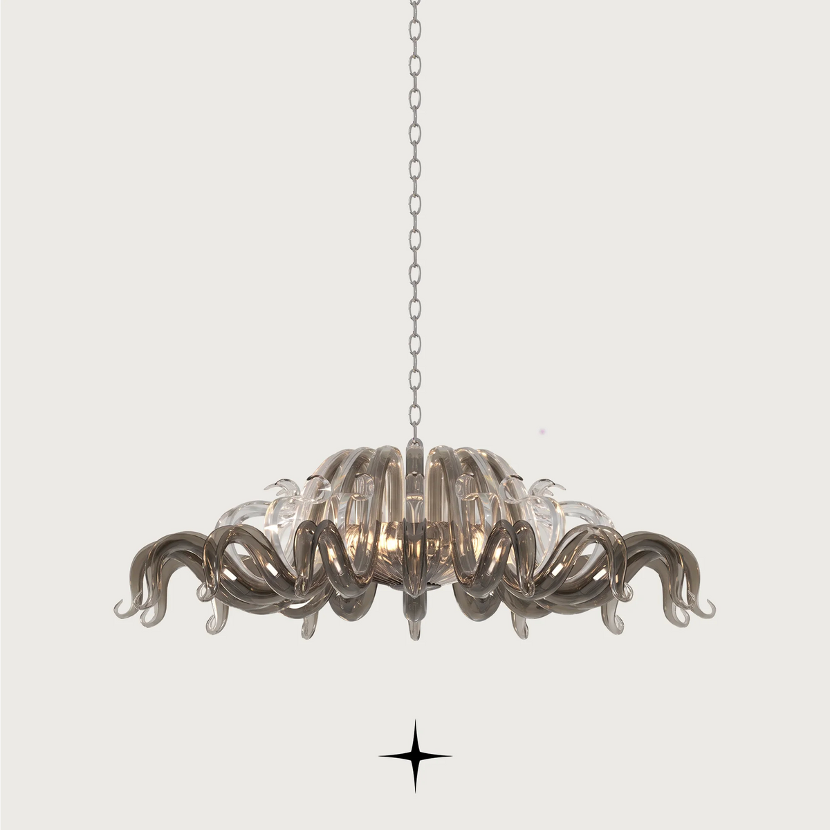 Majesty Chandelier featuring long curved clear dark crystal glass and 21 G9 LED lights.
