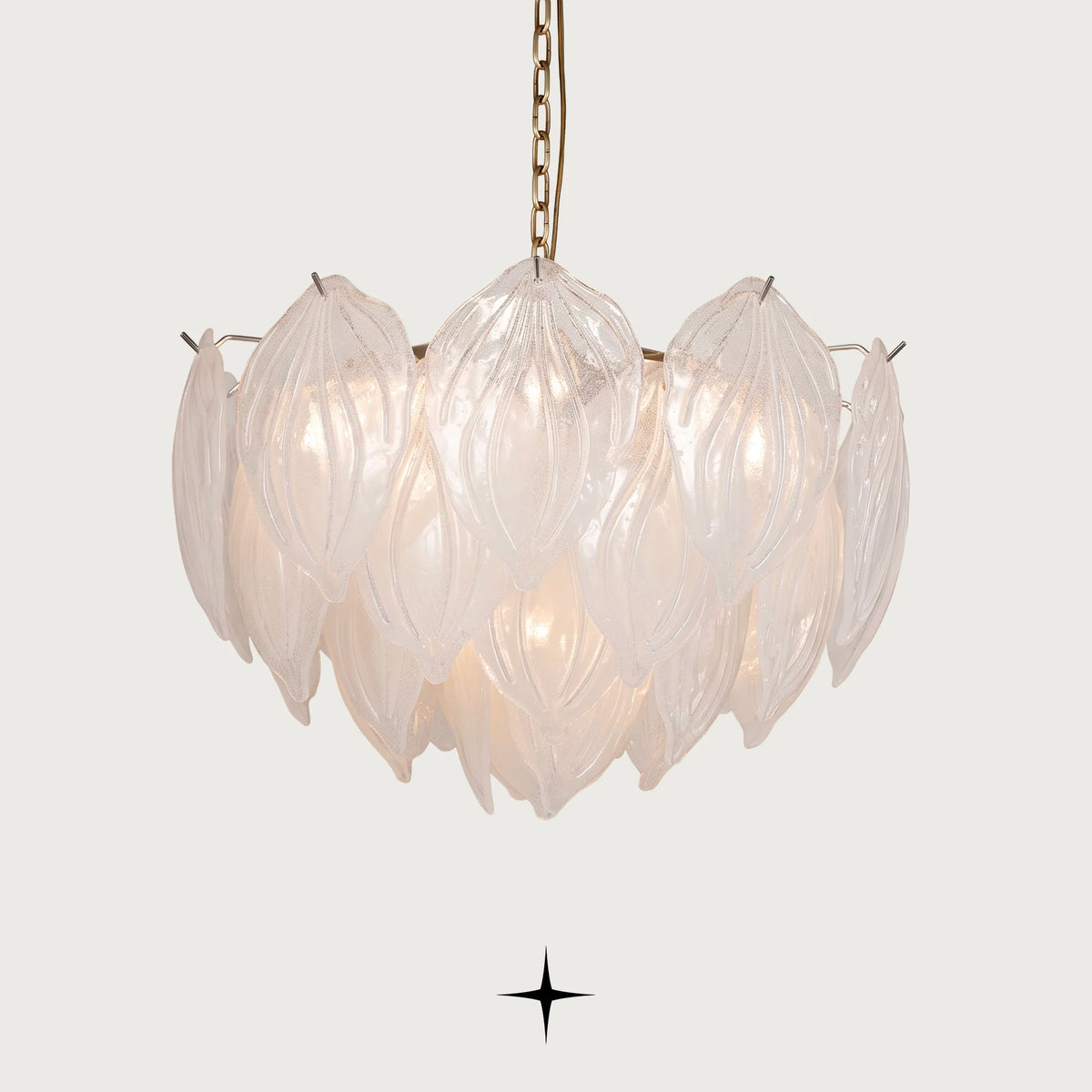 Mellow Murano style glass leaf chandelier with golden nickel structure on dark background