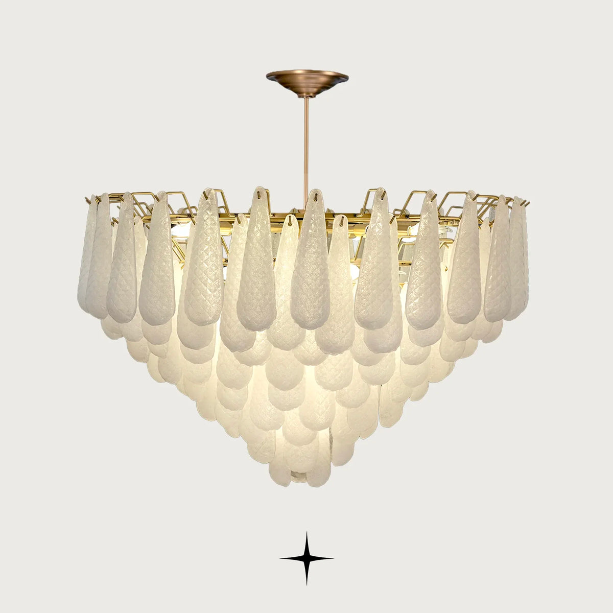 Miranda cascading textured glass droplet chandelier with gold stem on light grey background