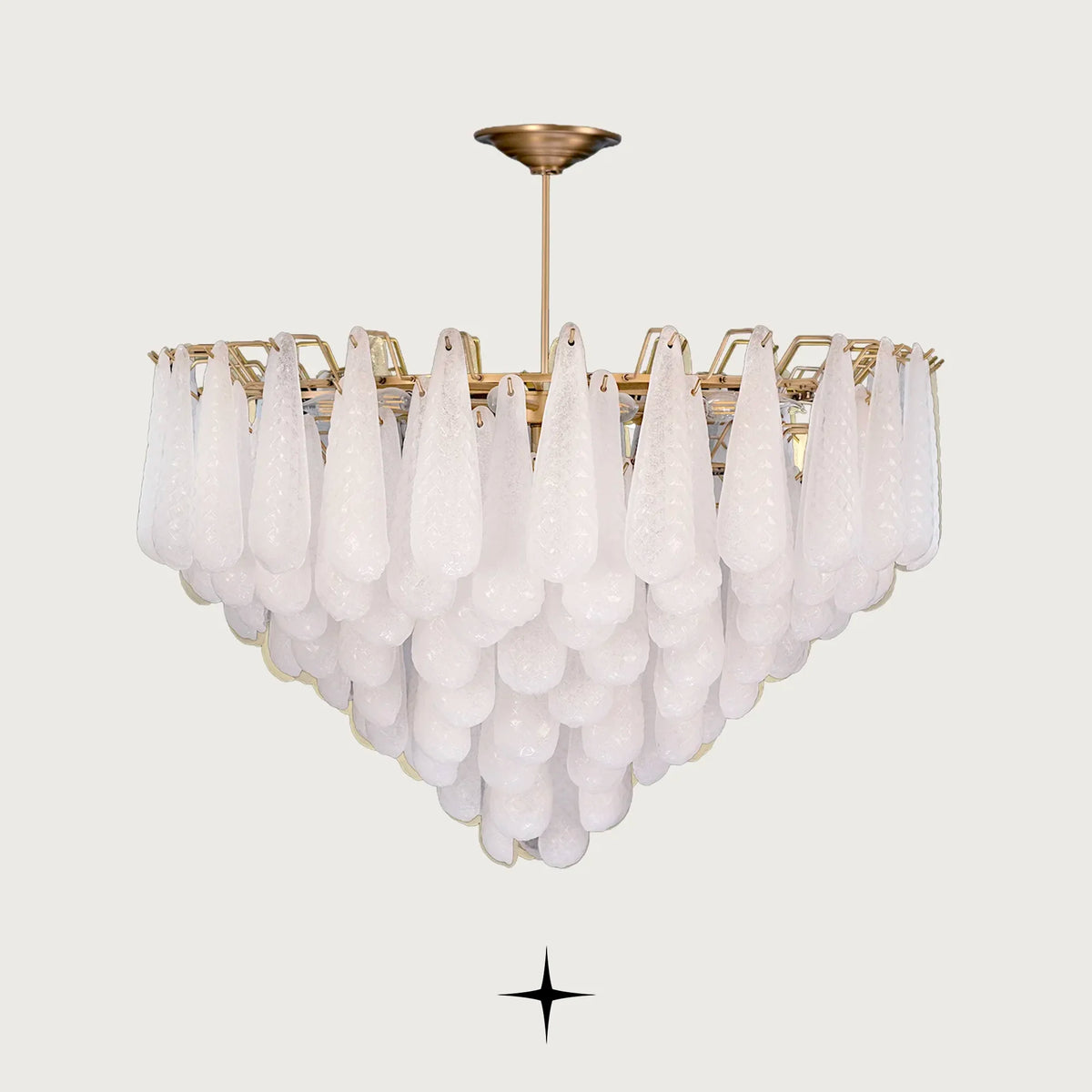 Miranda cascading textured glass droplet chandelier with gold stem on light grey background