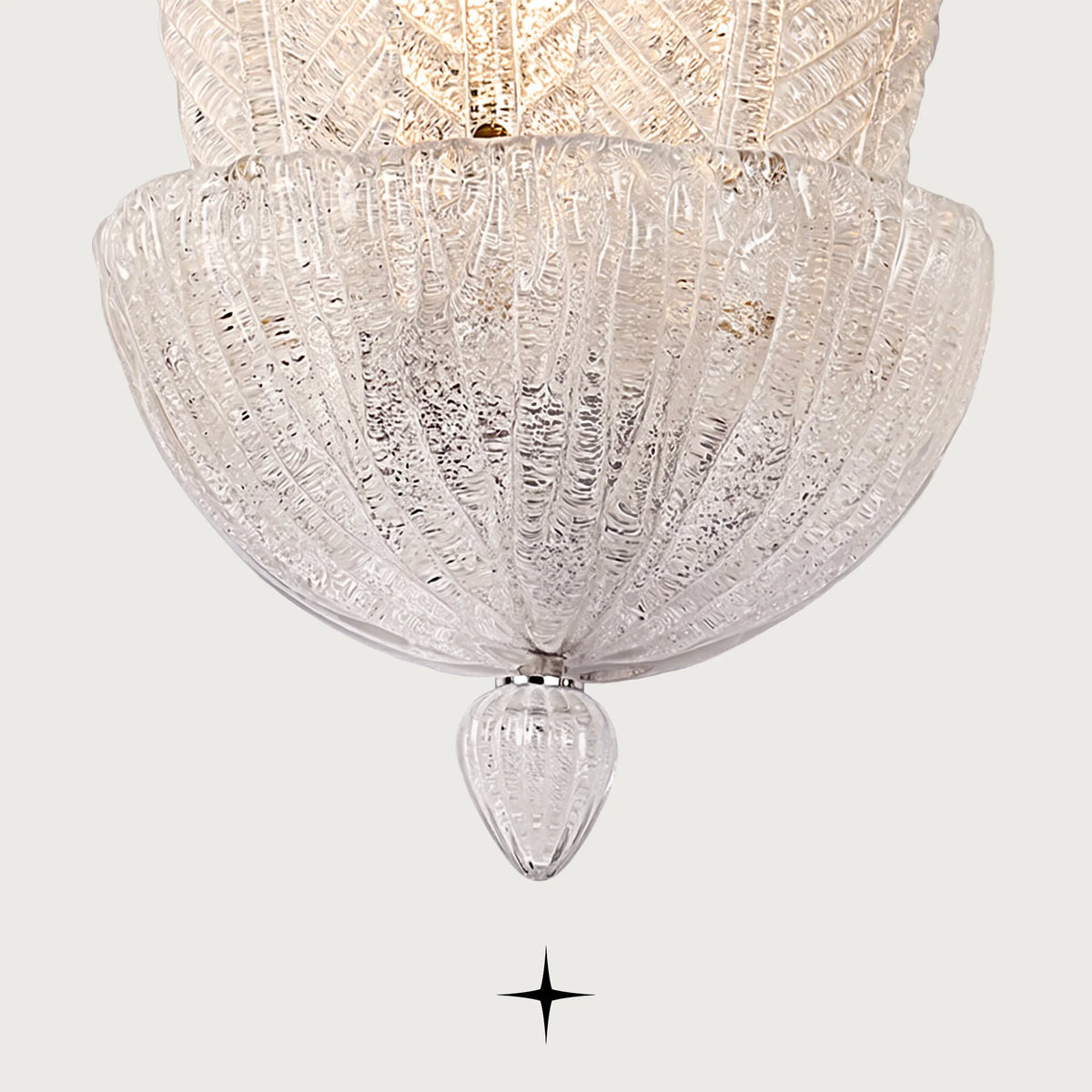 Close-up of textured dew glass petals on Mythic wall sconce