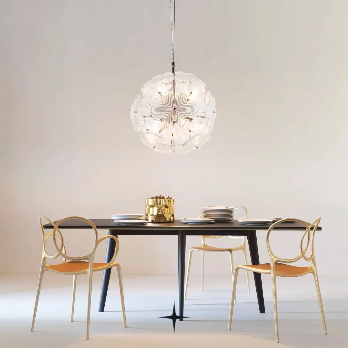 Nika round glass flower chandelier suspended over a modern black dining table
