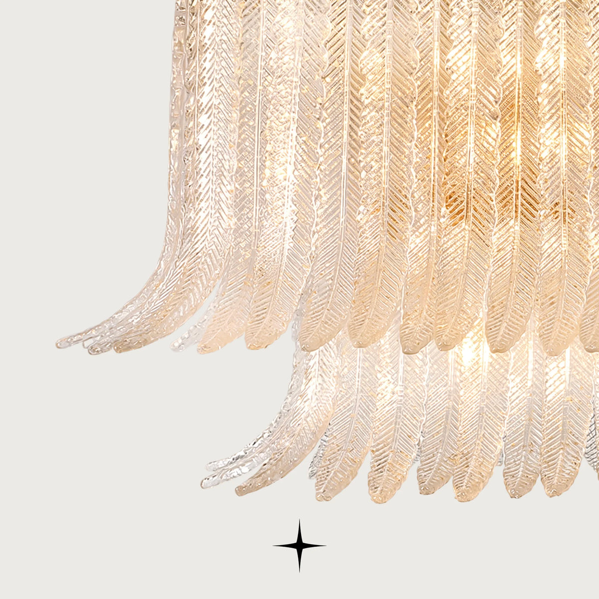 Close-up detail of layered glass feather elements on Oval Golden Falls chandelier
