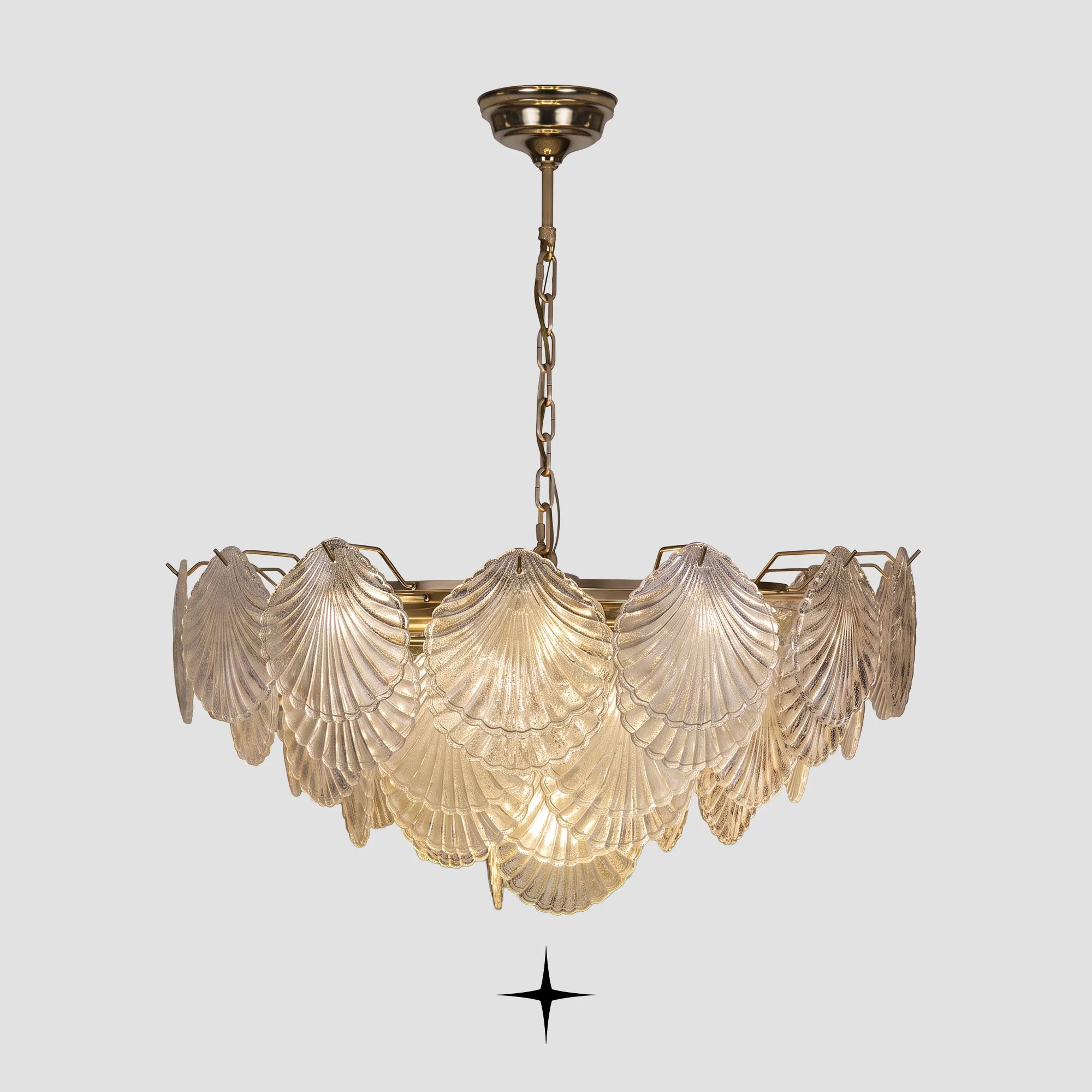 Shellina seashell-shaped textured glass chandelier with gold stem on light grey background