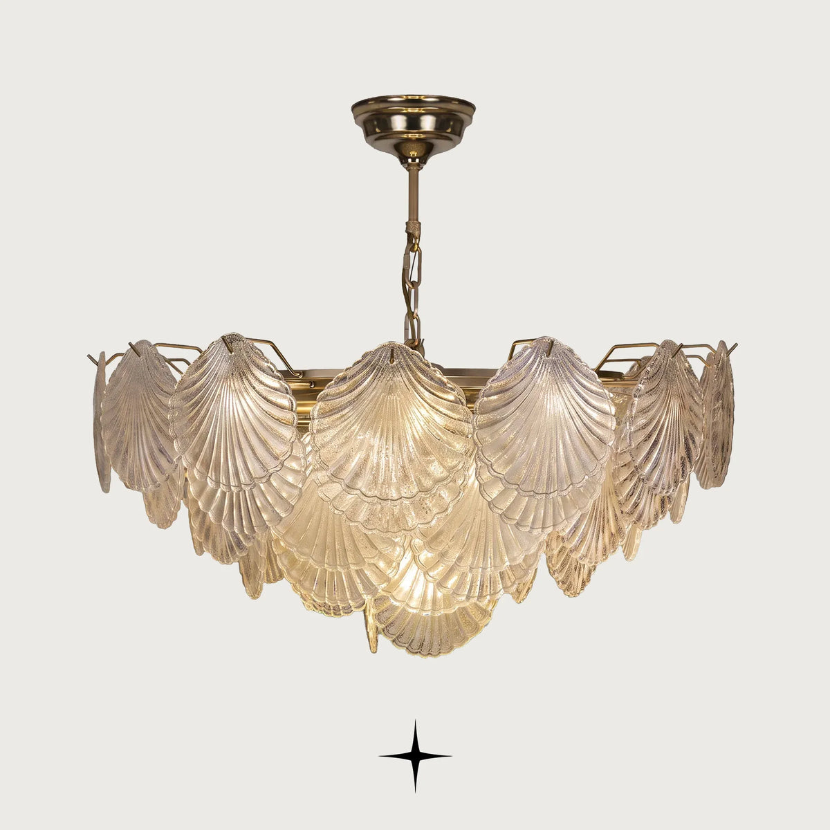 Shellina Seashell Glass Chandelier featuring intricately designed glass shades mimicking cascading seashells with warm brass accents
