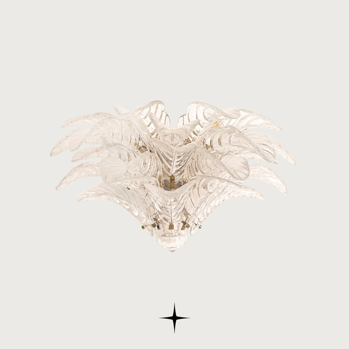 Sierra Murano style feather glass wall sconce with gold frame illuminated on a light grey background