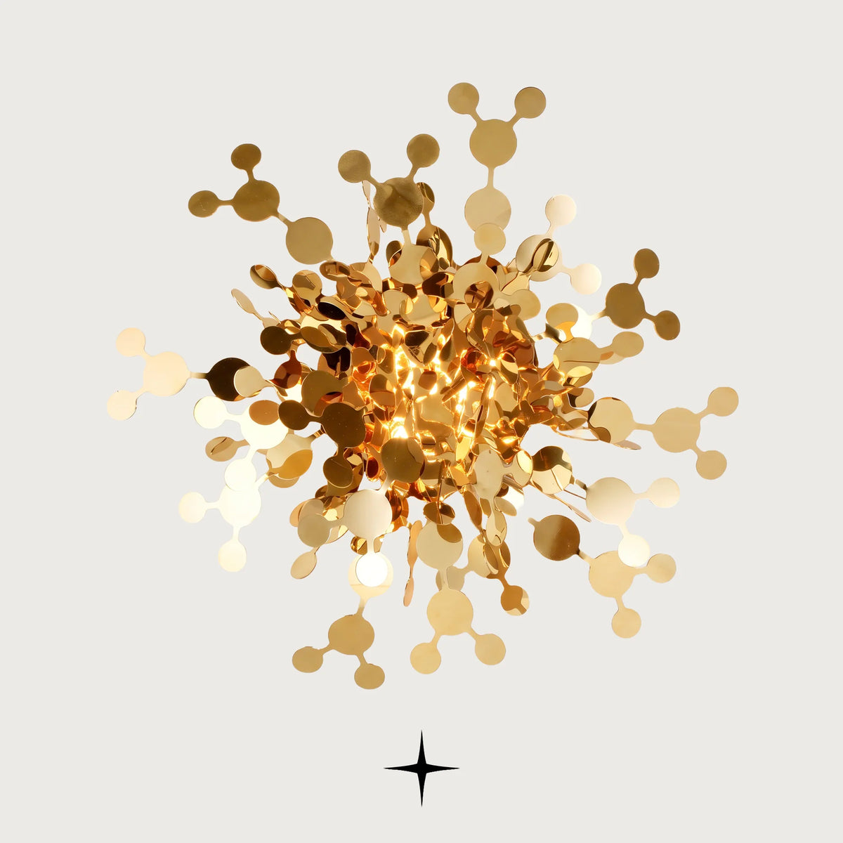 Sparkle modern gold sunburst wall sconce with metallic stems and discs on a light grey background