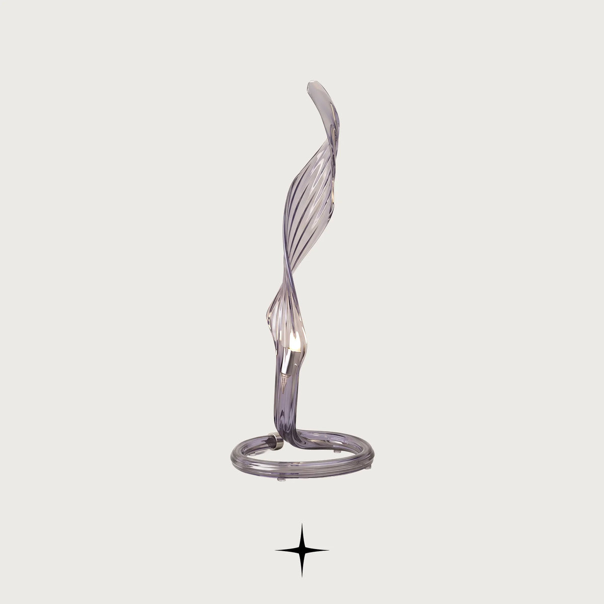 Uma modern sculptural table lamp with curved crystal arms on a light grey background