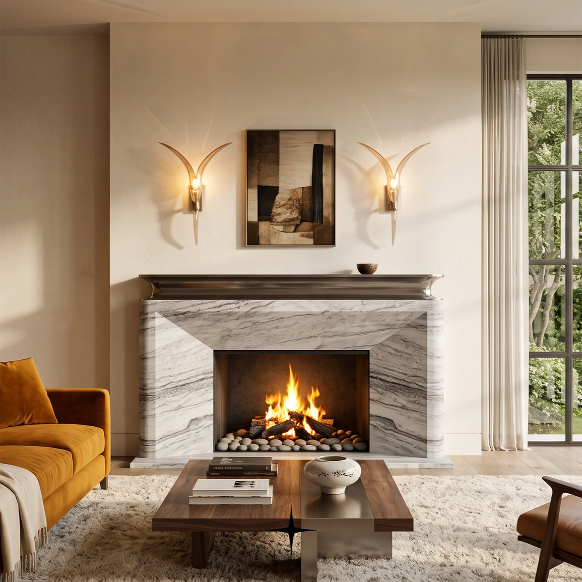 A modern living room scene featuring a white and gray marble fireplace with a lit fire, flanked by two waverly gold-toned wall sconces. An orange-brown velvet sofa, a wooden coffee table, and a large window with sheer curtains are visible in the room.