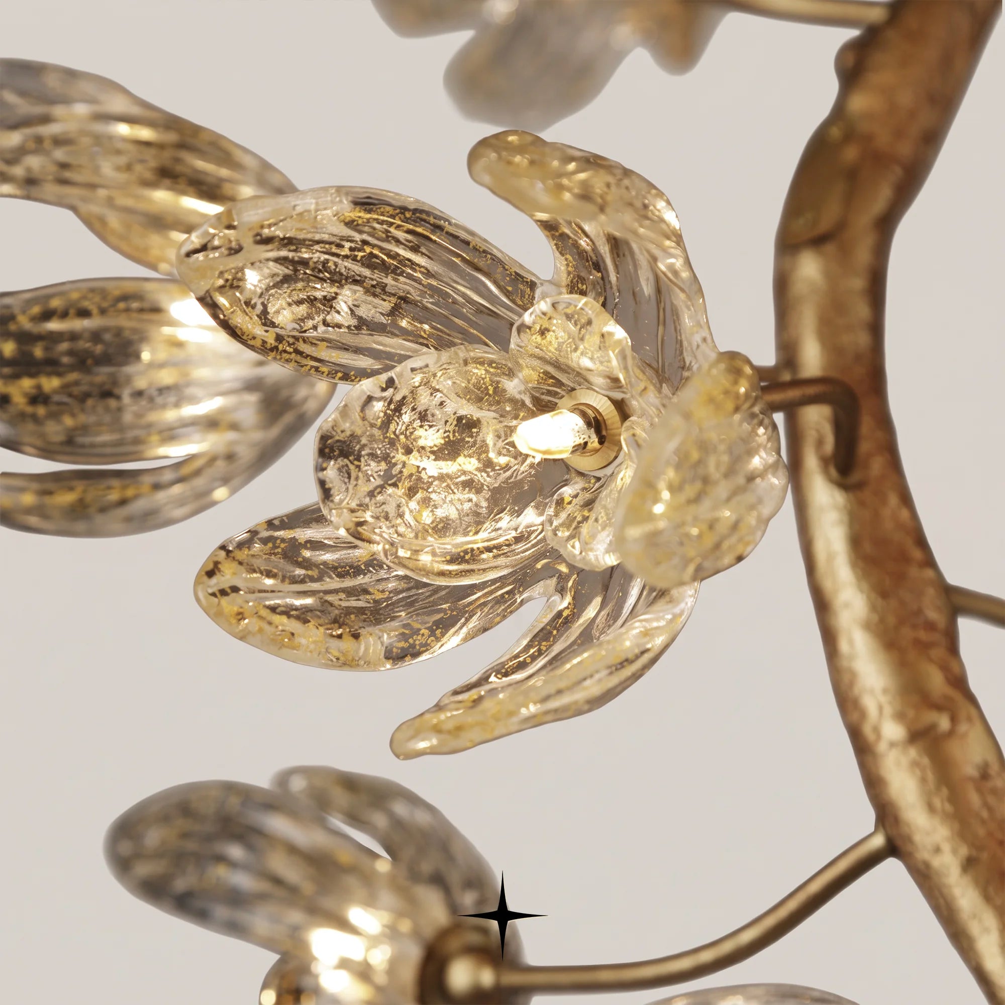 Close-up of illuminated crystal glass flowers on the Grand Sakura chandelier