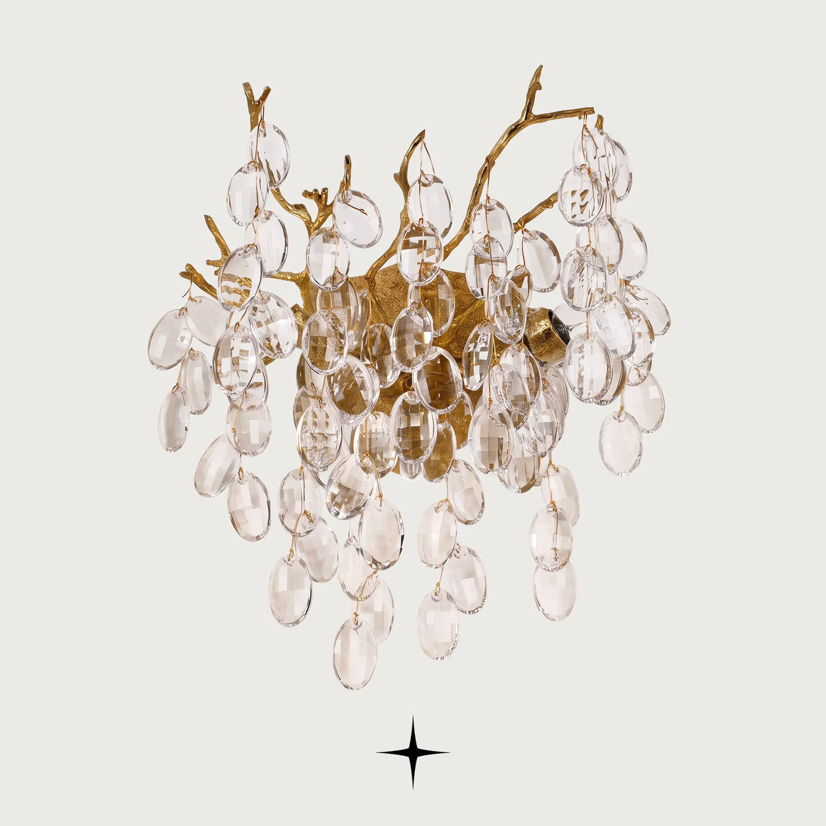 Zinnia crystal branch wall sconce with gold brass frame and clear crystal drops on light grey background